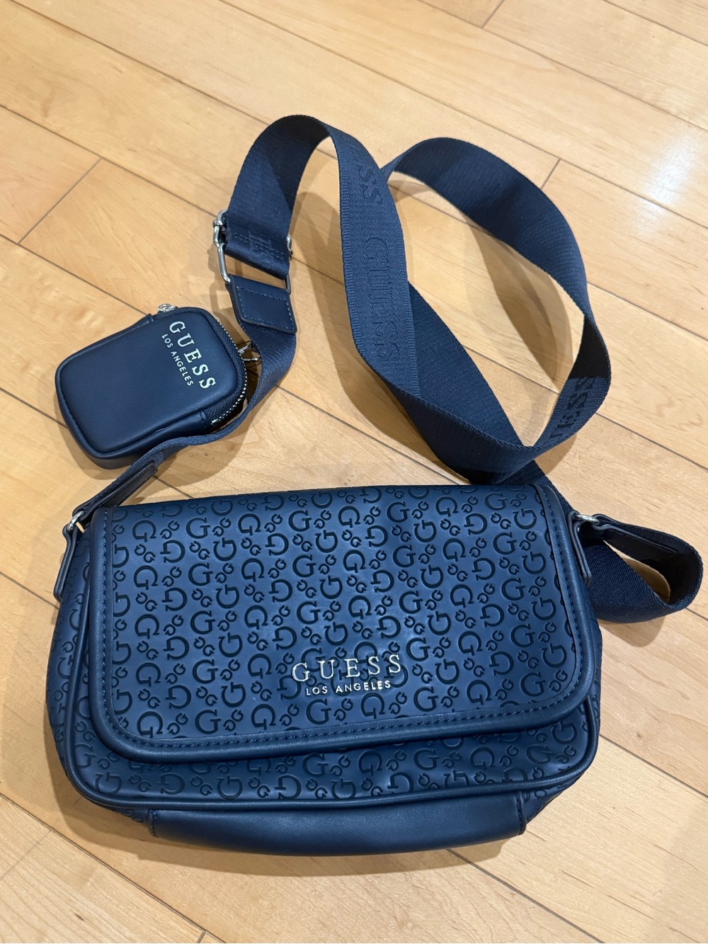 GUESS navy blue crossbody bag with coin purse.
